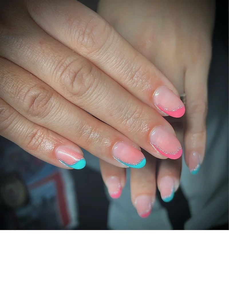 Coral and teal French tip nails with glitter