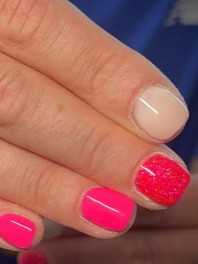 Hot pink and red glitter nails with nude accent