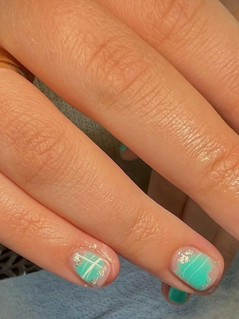 Mint green foil nails on short nails