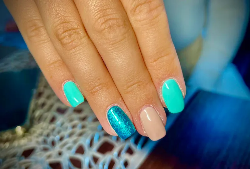 Mint green and teal glitter nails