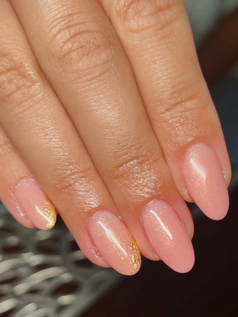 Nude pink shimmer nails with gold detail