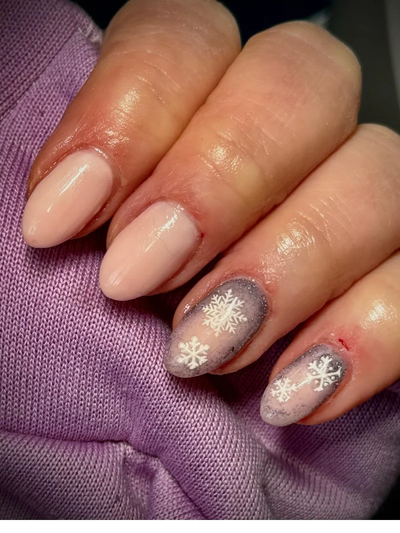 Nude nails with grey snowflake winter design