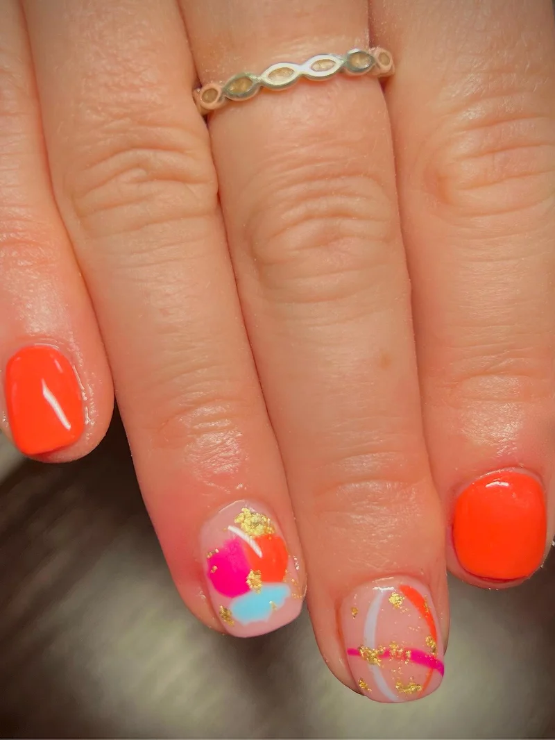 Orange abstract art nails with gold accents