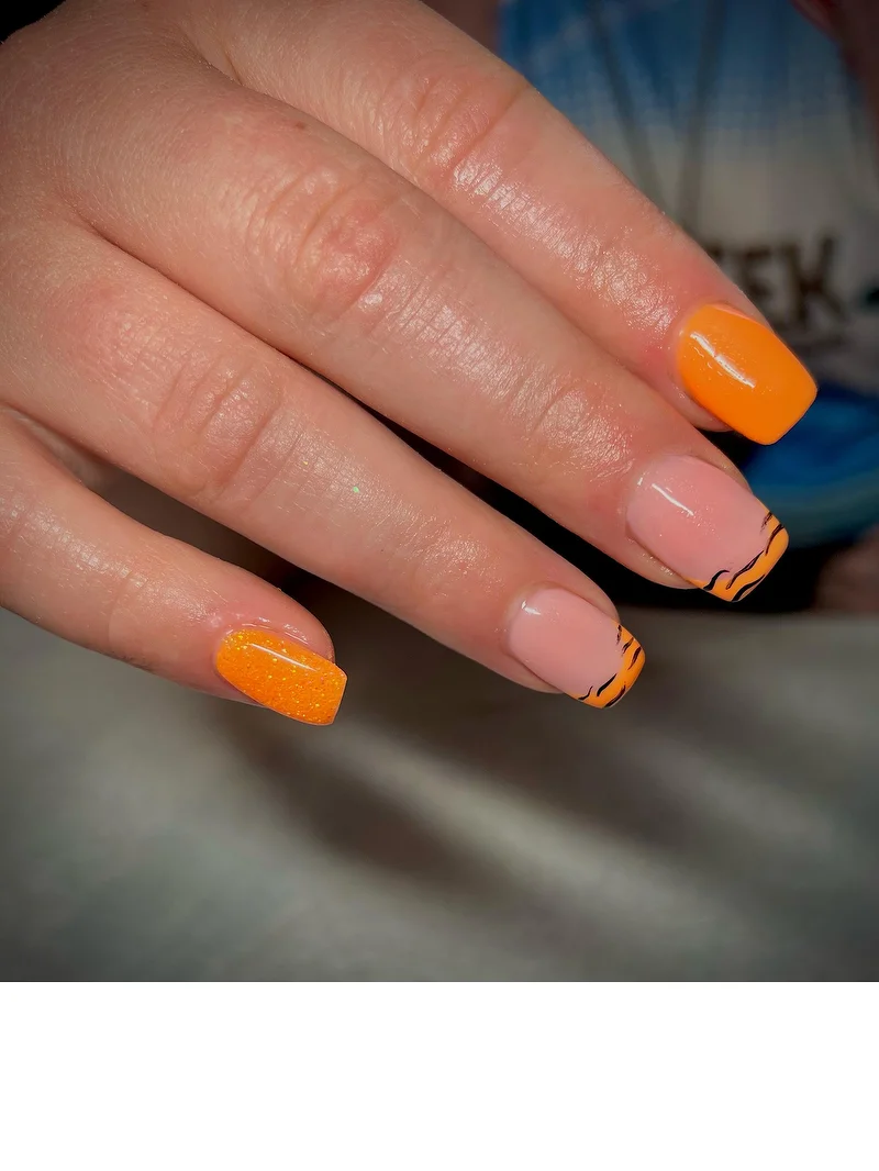 Orange tiger stripe French tip nails