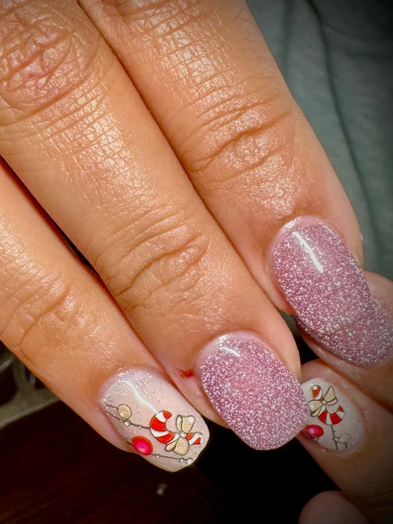 Pink glitter candy cane Christmas nails