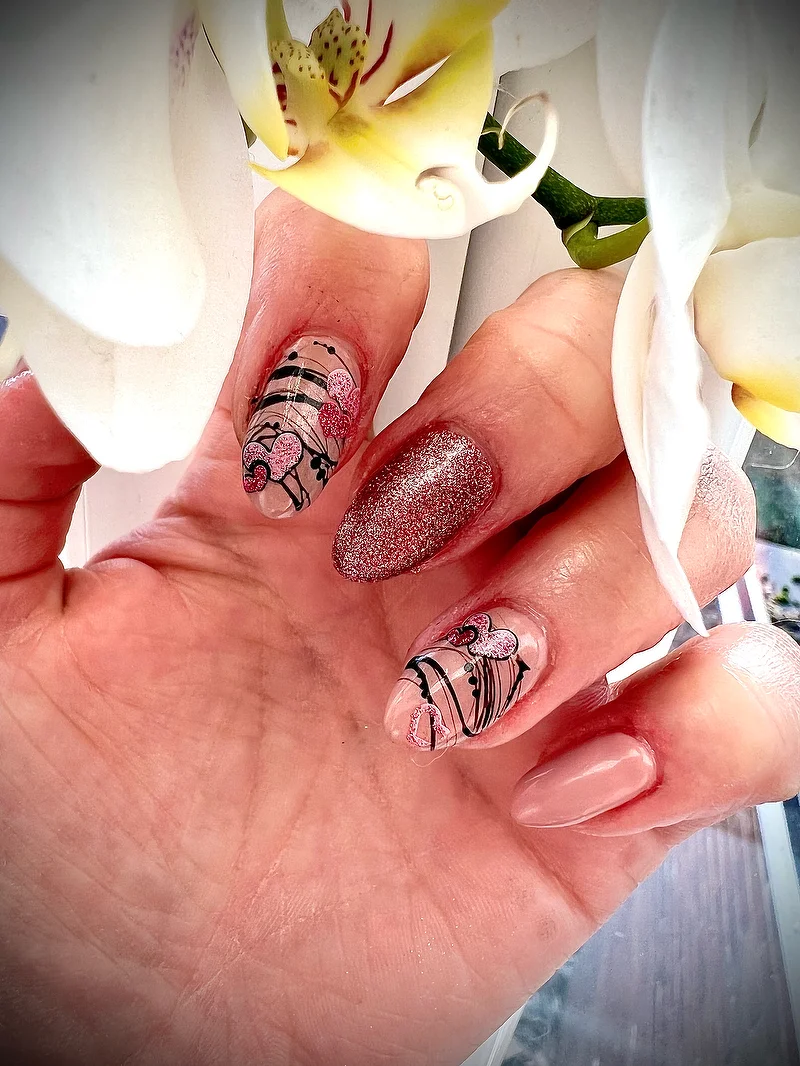 Pink glitter nails with floral art